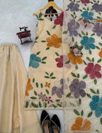 Cream organza silk plazzo suit set is adorned with colorful brush prints with sequence work