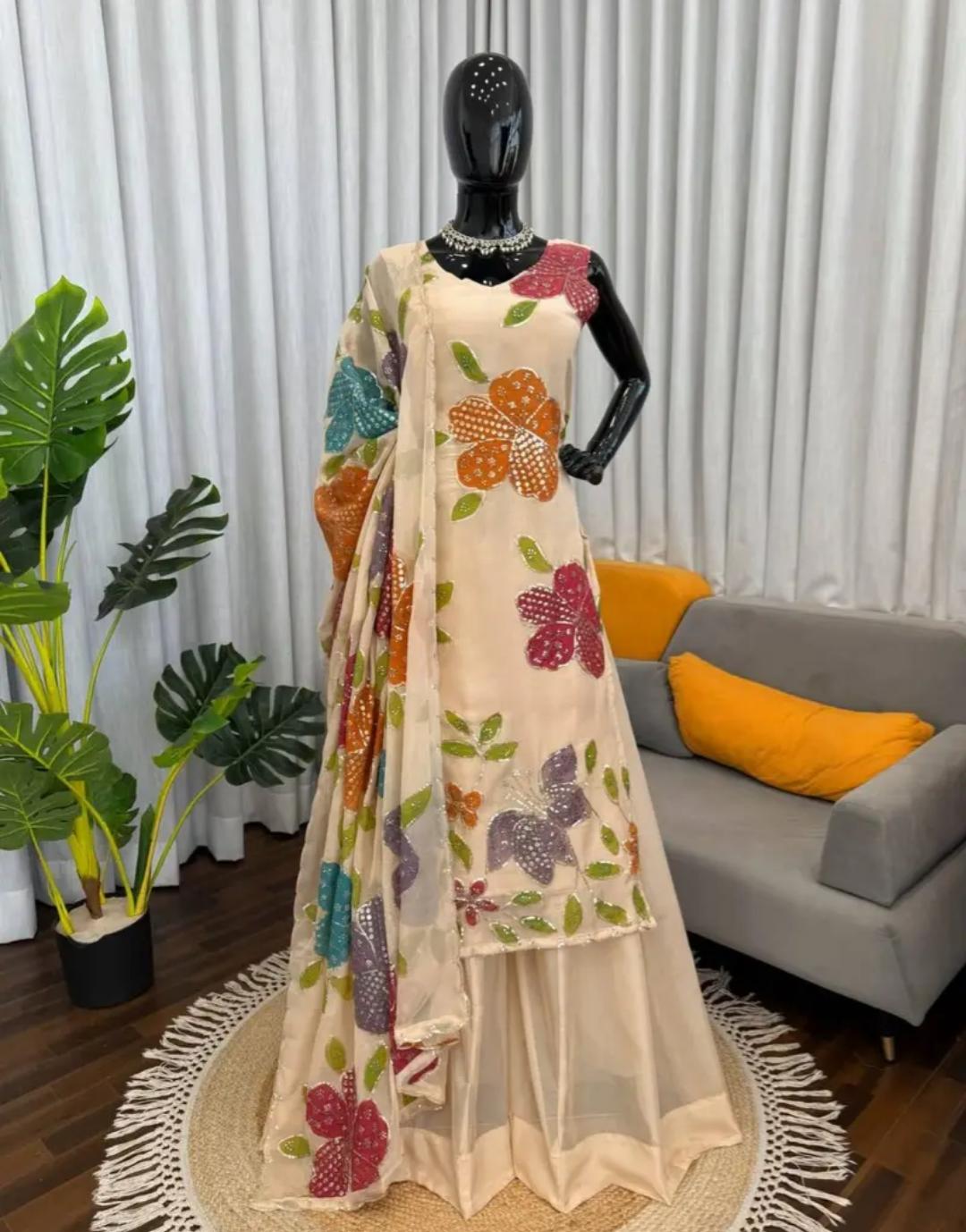 Cream organza silk plazzo suit set is adorned with colorful brush prints with sequence work