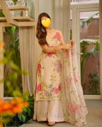 Cream organza silk plazzo suit set is adorned with colorful brush prints with sequence work